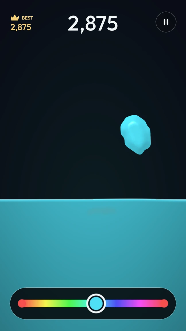Huevi gameplay: a cyan jelly blob falling toward matching liquid, with a rainbow slider at the bottom.