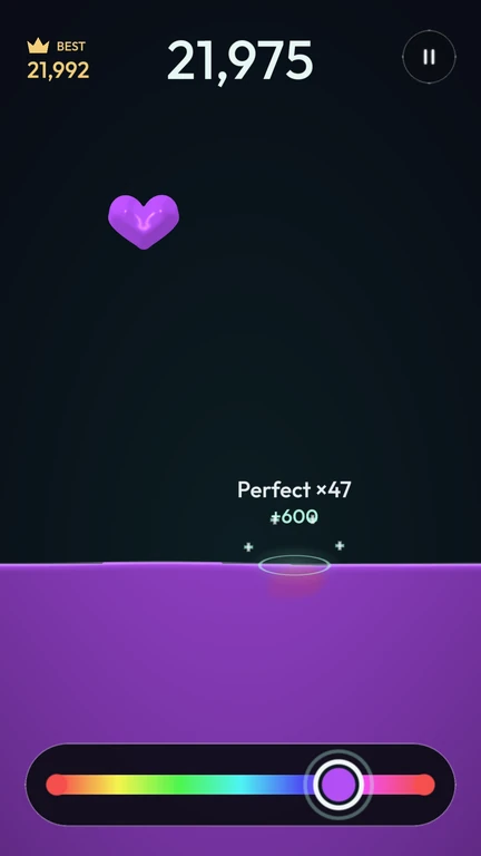 A heart-shaped jelly bonus falling toward the liquid.